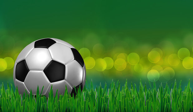 football on grass with green lighting background