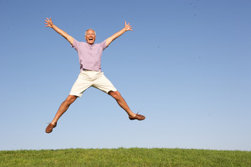 Fototapeta na wymiar Senior man jumping in air