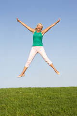 Senior woman  jumping in air