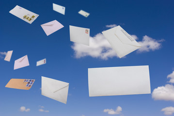 Envelopes flying against the blue sky