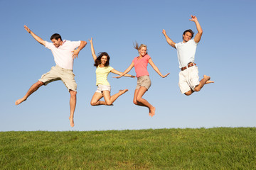 Young couples jumping in air