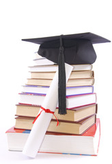 Student hat, diploma  and books