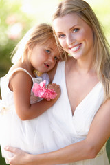 Bride With Bridesmaids Outdoors At Wedding