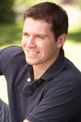 Portrait Of Young Man Relaxing In Park