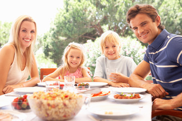 Parents, with children, enjoy a picnic