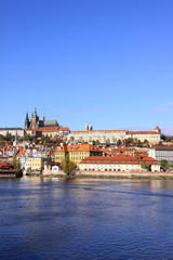 Naklejka na ściany i meble View on the autumn Prague gothic Castle above River Vltava