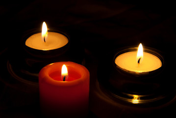 Three candles in the dark