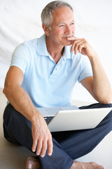 Senior man using laptop computer