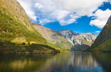 Mountains and norwegian fjord in autumn