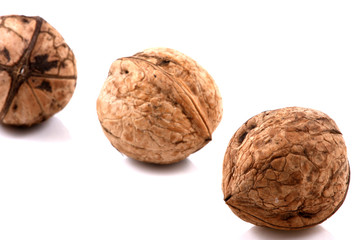 Dried walnuts on a white background