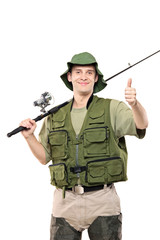 A happy fisherman with fishing pole giving thumbs up