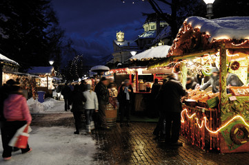 Evening on the Christmas Market, shopping, chatting, eating