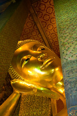 Reclining buddha within the Wat Pho in Bangkok Thailand