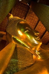Reclining buddha within the Wat Pho in Bangkok Thailand