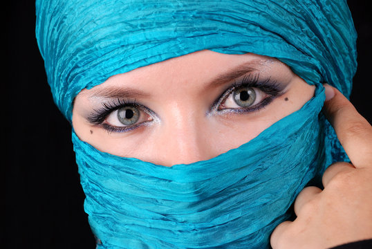 blue woman's eyes with east make-up