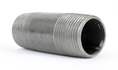 Small black threaded pipe laying on a white background