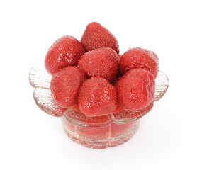 Large serving of whole canned strawberries in a glass dish