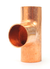 Copper tee pipe fitting on a white background.