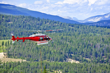 Rescue helicopter in mountains © Elenathewise