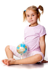 Beautiful girl playing with a globe