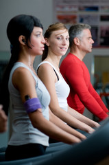 Obraz na płótnie Canvas Exercising with treadmill at gym