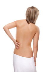 Naklejka premium Woman massaging pain back isolated on white