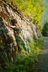 Beatiful girl near wall
