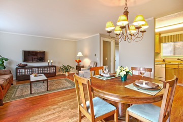 Living room with TV and dining area