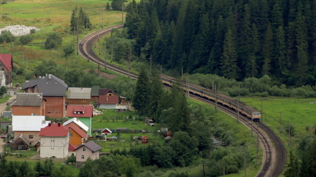 Time lapse of passenger train goes through the forest