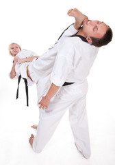 Two people in kimono fight on white