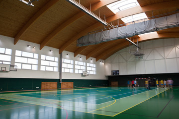interior of a modern multifunctional gymnasium with young people - obrazy, fototapety, plakaty