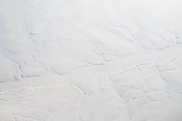 Rolgordijnen Aerial View Snowy Frozen River Cliffs Baffin Island, Canada © qingwa