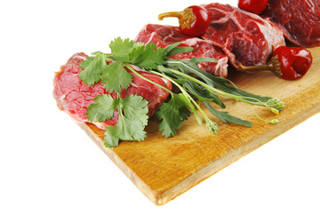 raw beef medallion on wood