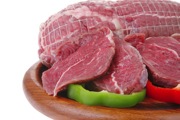 raw meat on wooden board