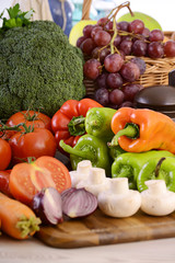 Composition with raw vegetables on kitchen table