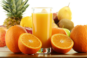 Composition with glass of orange juice and fruits