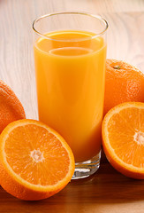 Composition with glass of orange juice and fruits