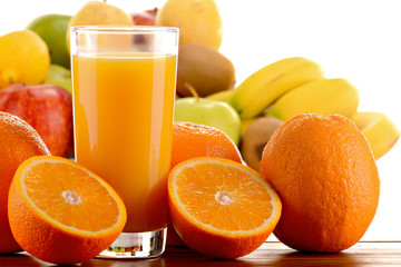 Composition with glass of orange juice and fruits