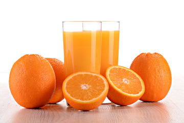 Composition with two glasses of orange juice and fruits