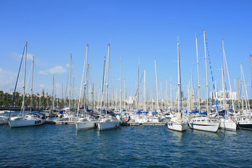 Fototapeta na wymiar Yachts at Port Vell in Barcelona. .