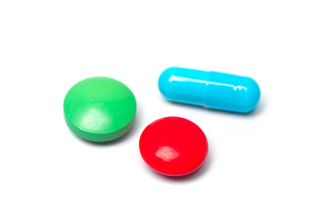 Three multicolored pills