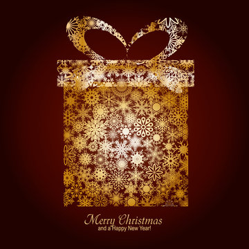 Christmas card with gift box made from gold snowflakes
