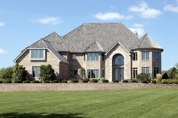 Luxury brick home with cedar roof