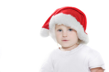 cute child in santa hat over white