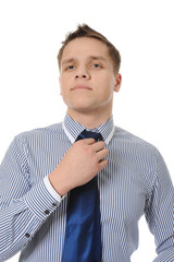 picture of a business man adjusting his tie