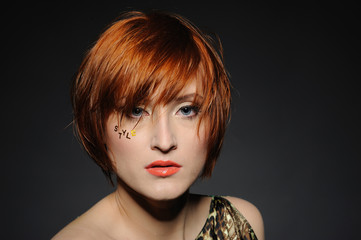 Beautiful red heaired woman portrait with fashion hairstyle and