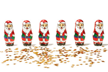 Santa Claus figures on a row