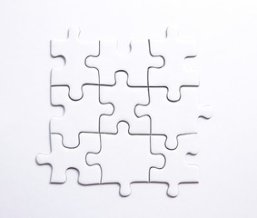 Quadratisches Stück aus 9 Puzzleteilen mit Textfreiraum