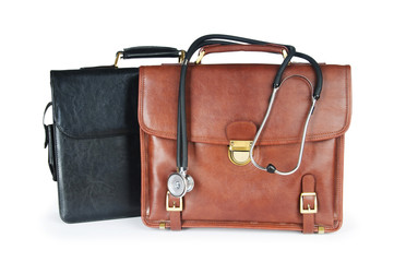 Cases and stethoscope isolated on the white