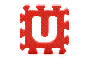 Alphabet puzzle pieces on white background